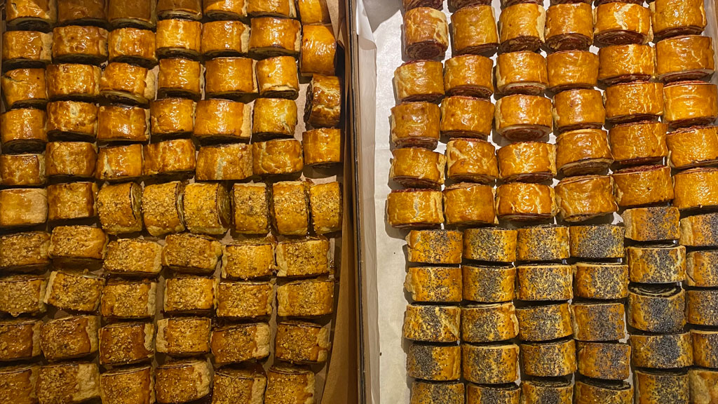 Trays of golden and poppy-seed rugelach arranged like a catering platter